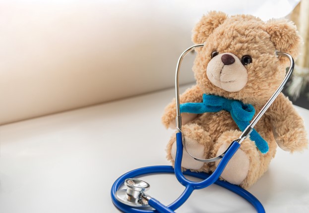 Children doctor concept – Teddy Bear with stethoscope. copy space